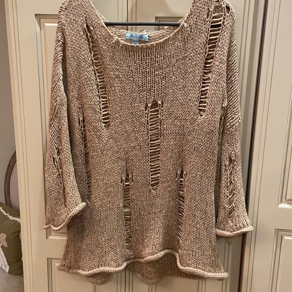 Torn look sweater